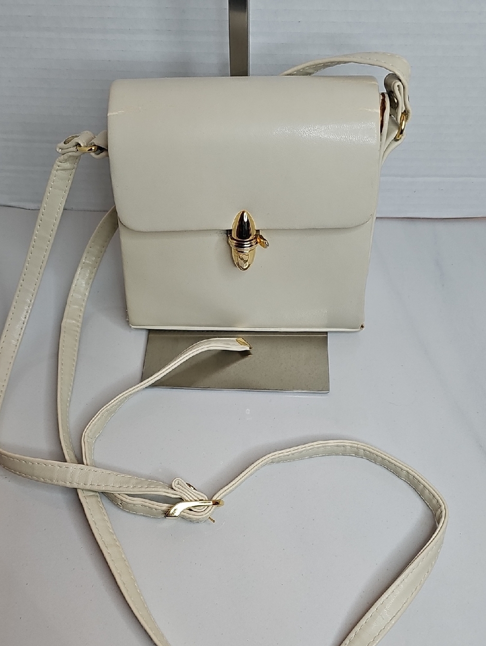 Elegant Cream Crossbody Bag with Gold Hardware